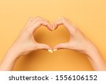 female hands show a heart... | Shutterstock . vector #1556106152