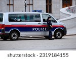 Small photo of Vienna, Austria, 06-10-2023, Austrian police in the center of Vienna, Policeman, Policewoman, Police car