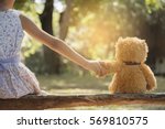 Teddy bear is a best friend for all little cute girl. Child autism can be more happy and fun when they're play in family. Feel love and care. Family Friendship Concept.