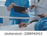 Small photo of Injured patient showing doctor broken wrist and arm with bandage in hospital office or emergency room. Sprain, stress fracture or repetitive strain injury in hand. Nurse helping customer. First aid.