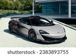 Small photo of Como, Italy - October 28, 2023: How much will the boss's new McLaren P1 LM parked in front of his company cost?