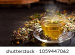 Cup Of Herbal Tea With Various...