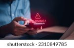 Small photo of Businessman or it staff , User or developer working computer laptop with triangle caution warning sign for notification error and maintenance concept.,programmer,developer,personal data protection.