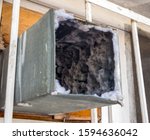 Old air duct filled with dust and dirt