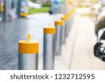 Stainless steel bollard barriers in front a shop prevent people for security.