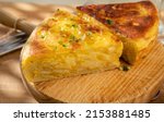 Small photo of Spanish vegetarian food, portion of homemade tasty potato omelette tortilla de patatas with onion served outdoor in morning sunlights