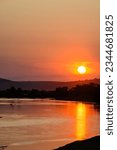 Small photo of View from Pont de Pouilly-sur-Loire bridge 496 km from the source and 496 km from the mouth of the Loire river near Pouilly-sur-loire, Central France ar sunset in summer