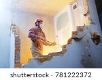 Worker With Sledgehammer At...