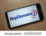 Small photo of KONSKIE, POLAND - December 01, 2018: BuyDomains logo displayed on smartphone