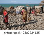 Small photo of Loiyangalani, Kenya – 11.28.2022: Men and women belonging to the Turkana tribe eke out an existence on the edge of Lake Turkana