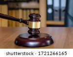 Small photo of Judicial gavel on the judge's table. Concept legal zone in the punishment system. Judgment of judgment concept of punishment and pardon. Symbol of law is the hammer of judge.