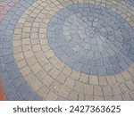 Small photo of The bricks are arranged in a pinwheel pattern. It can add visual interest and help to break up the monotony of a large expanse of paving. A particularly dynamic and eye catching variation.