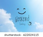 Weekend loading word and smile face on blue sky