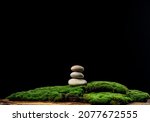 Stack Of Round Stones On Green...