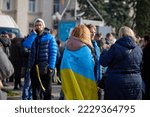 Small photo of Ukraine, Kherson - November 14, 2022: Crowd of people with Ukrainian flags on the streets of liberated Kherson, deoccupation celebration