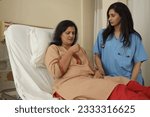 Small photo of Indian female patient patient coughing lying on patient bed Ready to give saline on the arm. nurse doctor ready to dry cough treatment. asian healthcare concept