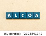 Small photo of Tile alphabet letter in word ALCOA (Abbreviation of Attributable, Legible, Contemporaneous, Original and Accurate) on wood background