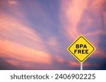 Small photo of Yellow transportation sign with word BPA (Bisphenol A) free on violet color sky background