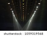 Many Par Led Lights beams Spotlight ray moving lighting on rack construction ceiling, for Fashion Show Event performance in dark room hall for fashion show style decorated floor