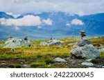 Small photo of Stone cairns dot the Valdresflye mountain plateau, creating a path of waypoints that guide travelers on mountain routes, along the Norwegian Scenic Route Valdresflye