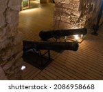 Small photo of Acre, Israel, June 26, 2021 : Two antique cast iron ship cannons at the exposition in the Crusader fortress of the old city of Acre in northern Israel
