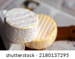 Small photo of Camembert on board. Cheese for advertising. For a large board. Bree from the oven. Cheese baked in the oven. Blue cheese. A piece of blue cheese. Camembert. Brie in the oven. Grilled. delicious