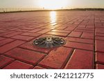 Small photo of Helicopter pad. A red landing area for helicopters at sunset. Helipad landing lights. Illumination equipment for helicopter landing pads.