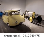Small photo of Malaga, Spain - December 29, 2023: 1955 Fuldamobil Type S and 1914 Barron Ackroyd at automobile museum.