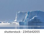 Small photo of Edge lighting on icebergs; Scoresby Sund, Greenland; Flying buttress arch; Scoresby Sund, Greenland