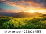 Small photo of The breathtaking beauty of nature with this stunning mountain landscape scenery stock photo. As the sun sets, it casts a warm golden glow over the majestic peaks, creating a mesmerizing scene.