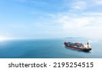 Container cargo ship in the ocean at sunset blue sky background with copy space, Nautical vessel and sea freight shipping, International global business logistics transportation import export concept