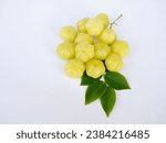 Small photo of Many gooseberries and gooseberry leaves are placed on a white background. It has a sour taste. It is a gooseberry that I naturally planted.