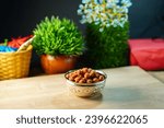 Roasted masala coated crunchy and spicy masala peanuts or mungfali served in a bowl , Peanut ,groundnut, oil nut, monkey nut good for cardiovascular health.Traditional kerala snack, Kerala snacks