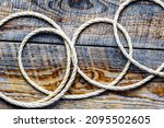 Small photo of rope gyrate on a wooden table