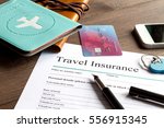 concept booking travel insurance on wooden background