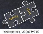 Small photo of Chalk drawing of two puzzles with words horrify and elate. Concept of solving problems