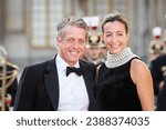 Small photo of Versailles, France, 20-09-2023 : Hugh Grant and Anna Eberstein arrives before the State Dinner with Charles III and Queen Camilla at the Palace of Versailles.