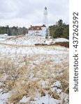 Small photo of The Rawley's Point Lighthouse faces the Lake Michigan shore in winter, Manitowoc County, Wisconsin