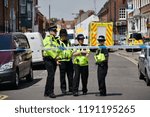 Small photo of Salisbury, UK - July 6, 2018: Police cordon off a hostel in the city centre as investigations continue after local residents Charlie Rowley and Dawn Sturgess fell ill with nerve agent poisoning.