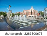 Small photo of Samara, Russia – June 22, 2018. Fountain at the Samara Embankment along the banks of the Volga River in Samara, Russia. View with people and commercial properties on a sunny summer day.