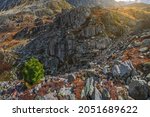 Scattering of stones, granite rock. Rocky mountain slope, chaotic mountain landscape.