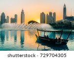 Singing fountains in Dubai. Dubai promenade singing fountains on the background of architecture. Dubai. In the summer of 2016.