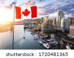 Canadian National Flag Overlay. False Creek, Downtown Vancouver, British Columbia, Canada. Beautiful Aerial View of a Modern City on the West Pacific Coast during a colorful Sunset.