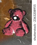 grunge and scary teddy bear poster image on wall, street art style, wheat paste image, grunge teddy bear poster image on wall, wheat paste, street art, stuffed animal