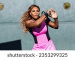 Small photo of Los Angeles, California, USA - November 7, 2013 - Serena Williams playing tennis at a Los Angles country club.