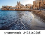 Small photo of St Julians, Malta - February 14, 2024: Our Lady of Mount Carmel Church , early mornong on Balluta Bay , famous touristic place in in St. Julian's , Malta