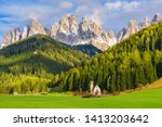 Sunny landscape of Dolomite Alps. St Johann Church with beautiful Dolomiti mountains, Santa Maddalena, Val Di Funes, Dolomites, Italy.