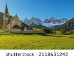 Santa Maddalena village with church and beautiful Dolomiti mountains, Val Di Funes, Dolomites, Italy in sunny morning. Travel destination