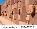 Small photo of Carved stone head sculptures in the semi subterranean courtyard temple in Tiwanaku, La Paz, Bolivia.