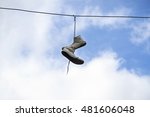 Sneakers Hanging On Wires On A...